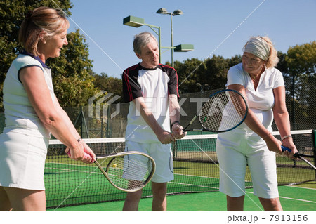Senior and mature adults practising on tennis courts Senior and mature adults practising on tennis courts 7913156