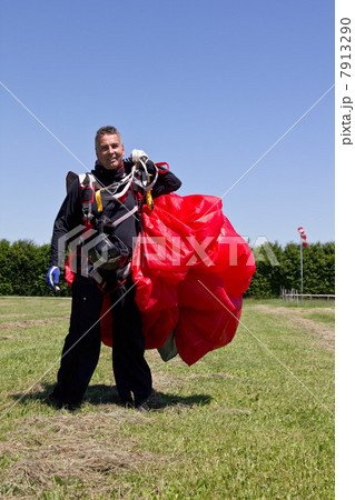 Skydiver holding parachute 7913290