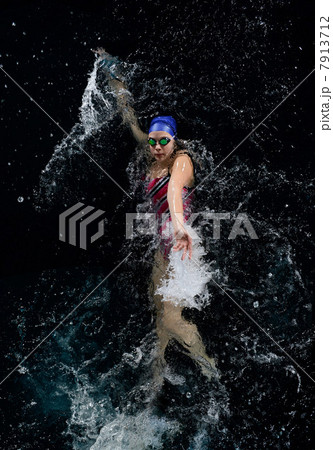 Teenage girl doing backstroke in swimming pool 7913712