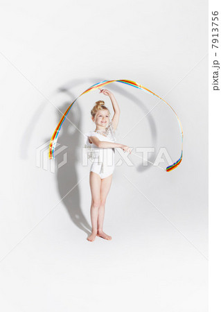 Girl playing with ribbon streamers 7913756