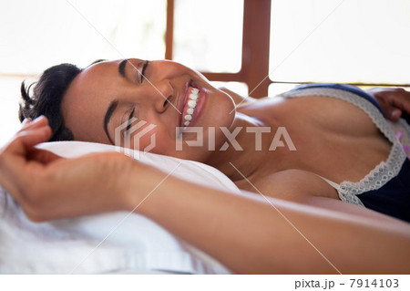 Woman lying on bed Woman lying on bed 7914103