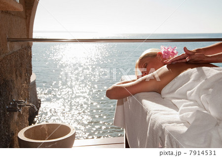 Woman having massage by the ocean 7914531