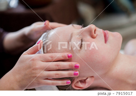 Young woman having facial treatment Young woman having facial treatment 7915017