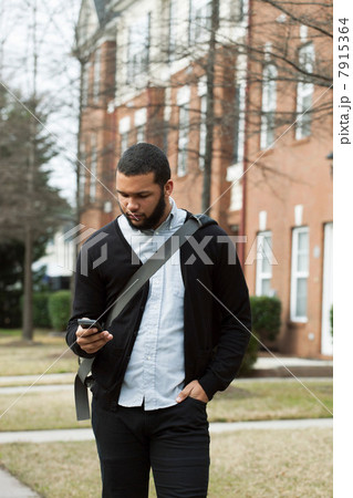 Young man with cell phone Young man with cell phone 7915364
