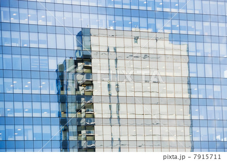 Skyscraper reflected in windows 7915711