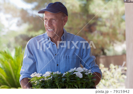 Older man gardening outdoors Older man gardening outdoors 7915942