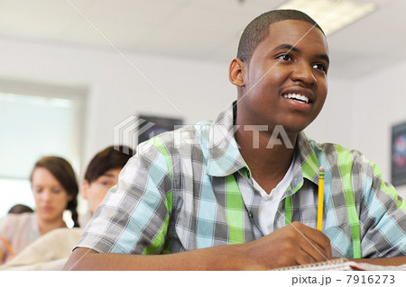 Male high school student working in classroom 7916273