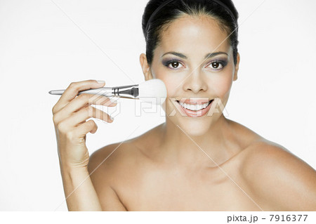 Woman with makeup brush 7916377