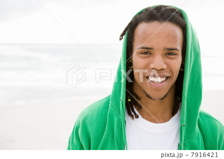 Young man with green hooded top, portrait Young man with green hooded top, portrait 7916421