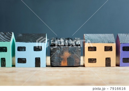 Burned model house on counter 7916616