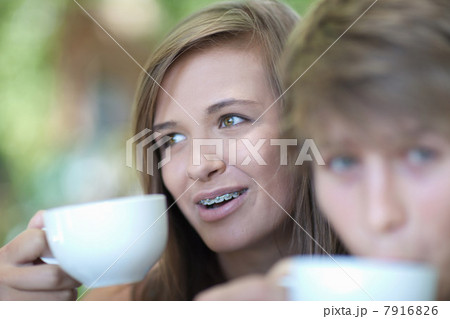 Couple having coffee together outdoors Couple having coffee together outdoors 7916826