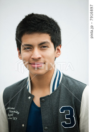 Young man wearing baseball jacket, portrait Young man wearing baseball jacket, portrait 7916897