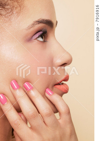 Side view of woman wearing make up and nail polish Side view of woman wearing make up and nail polish 7916916