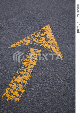 Yellow arrow on asphalt Yellow arrow on asphalt 7916966
