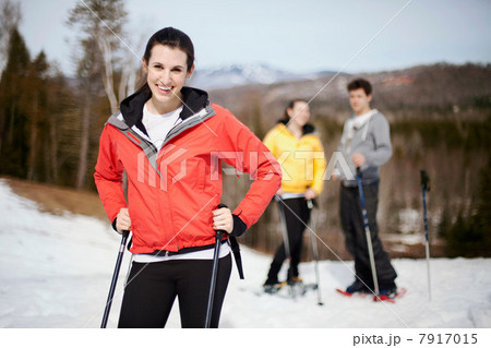 Young woman with ski poles 7917015