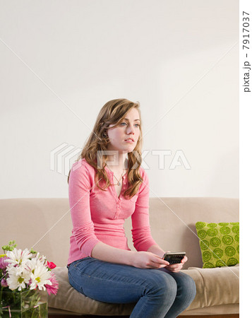 Teenage girl with pensive expression 7917037