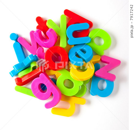 Alphabet fridge magnets in a pile 7917242