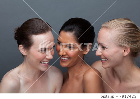Three young woman laughing 7917425