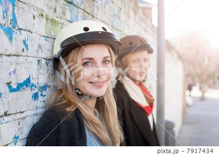Women wearing bicycle helmets 7917434