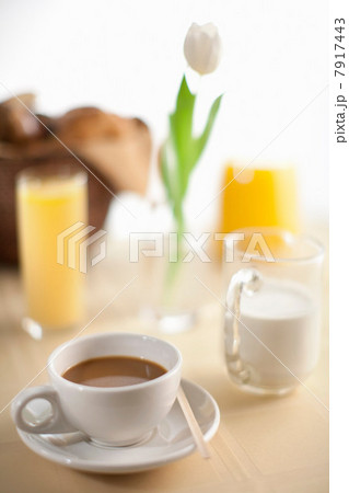 Cup of coffee with milk and orange juice 7917443