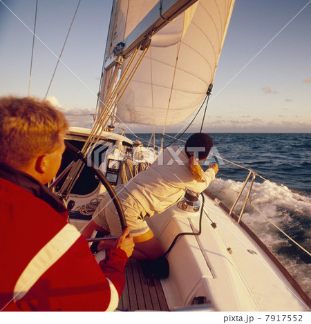 Man and woman sailing yacht together 7917552