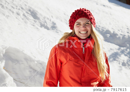 Portrait of woman wearing red knit hat and coat Portrait of woman wearing red knit hat and coat 7917615