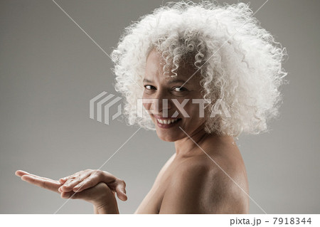 Mature woman touching palm of hand 7918344