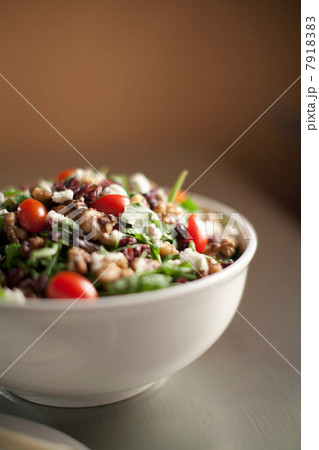 Bowl of chopped salad on table 7918383