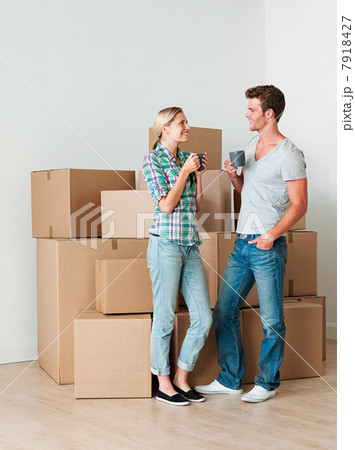 Young couple taking a break from unpacking Young couple taking a break from unpacking 7918427