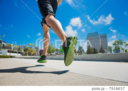 Young man jogging in city, low section 7918637