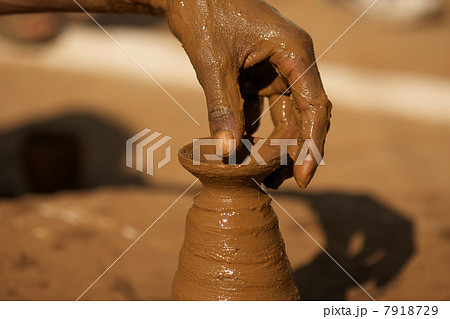 Close up of potter at work in Orchha, Madhya Pradesh, India Close up of potter at work in Orchha, Madhya Pradesh, India 7918729