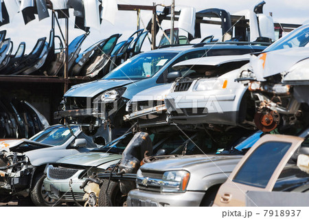 Cars stacked in scrap yard 7918937