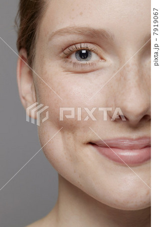 Close up of part of young woman's face, smiling 7919067