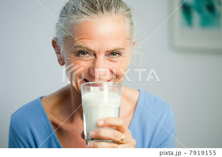 Mature woman drinking milk Mature woman drinking milk 7919155