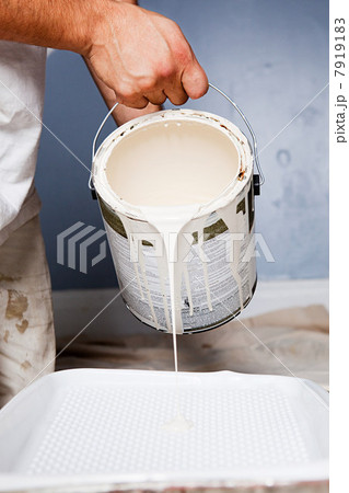 Man pouring paint Man pouring paint 7919183