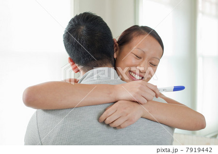 Happy couple taking pregnancy test 7919442
