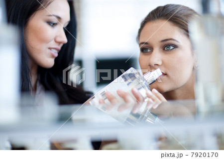 Women smelling soap in store Women smelling soap in store 7920170
