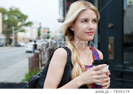 Woman with coffee to go 7920174