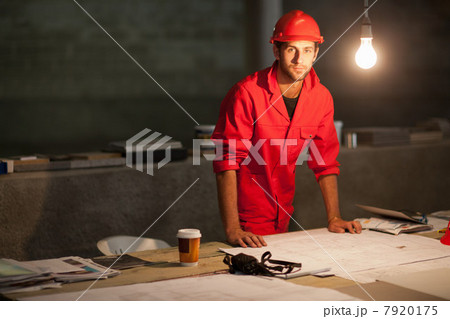 Building contractor working late on site 7920175