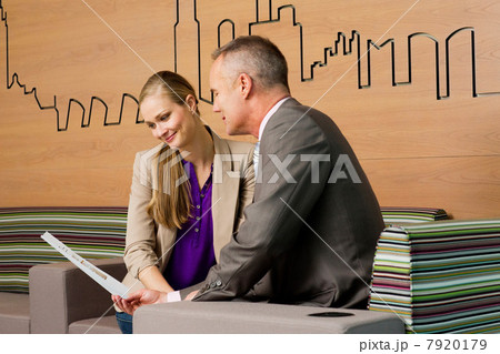 Estate agent meeting with client in office 7920179