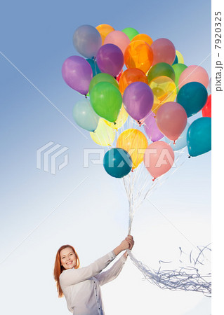 Young woman outdoors with balloons 7920325