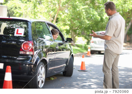 Father teaching teenage daughter driving Father teaching teenage daughter driving 7920360