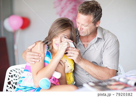 Father comforting teenage daughter Father comforting teenage daughter 7920382