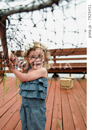 View of girl through net 7920451