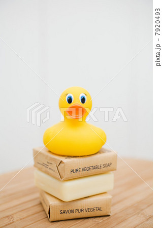 Rubber duck on top of stack of soap 7920493