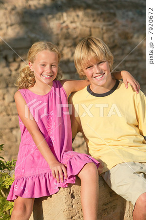 Happy brother and sister outdoors 7920672