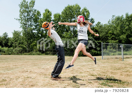 Couple wearing wrestling masks play fighting Couple wearing wrestling masks play fighting 7920828