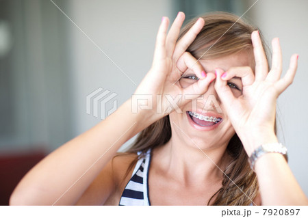 Smiling teenage girl making face 7920897
