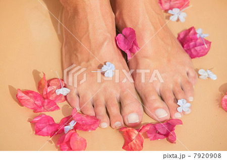 Woman with flowers at her feet 7920908