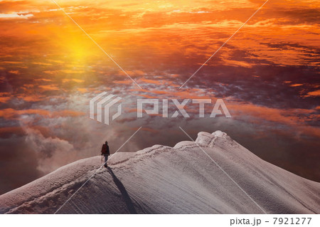 Person on mountain at sunset, Piz Palu, St Moritz, Canton Graubunden, Switzerland 7921277